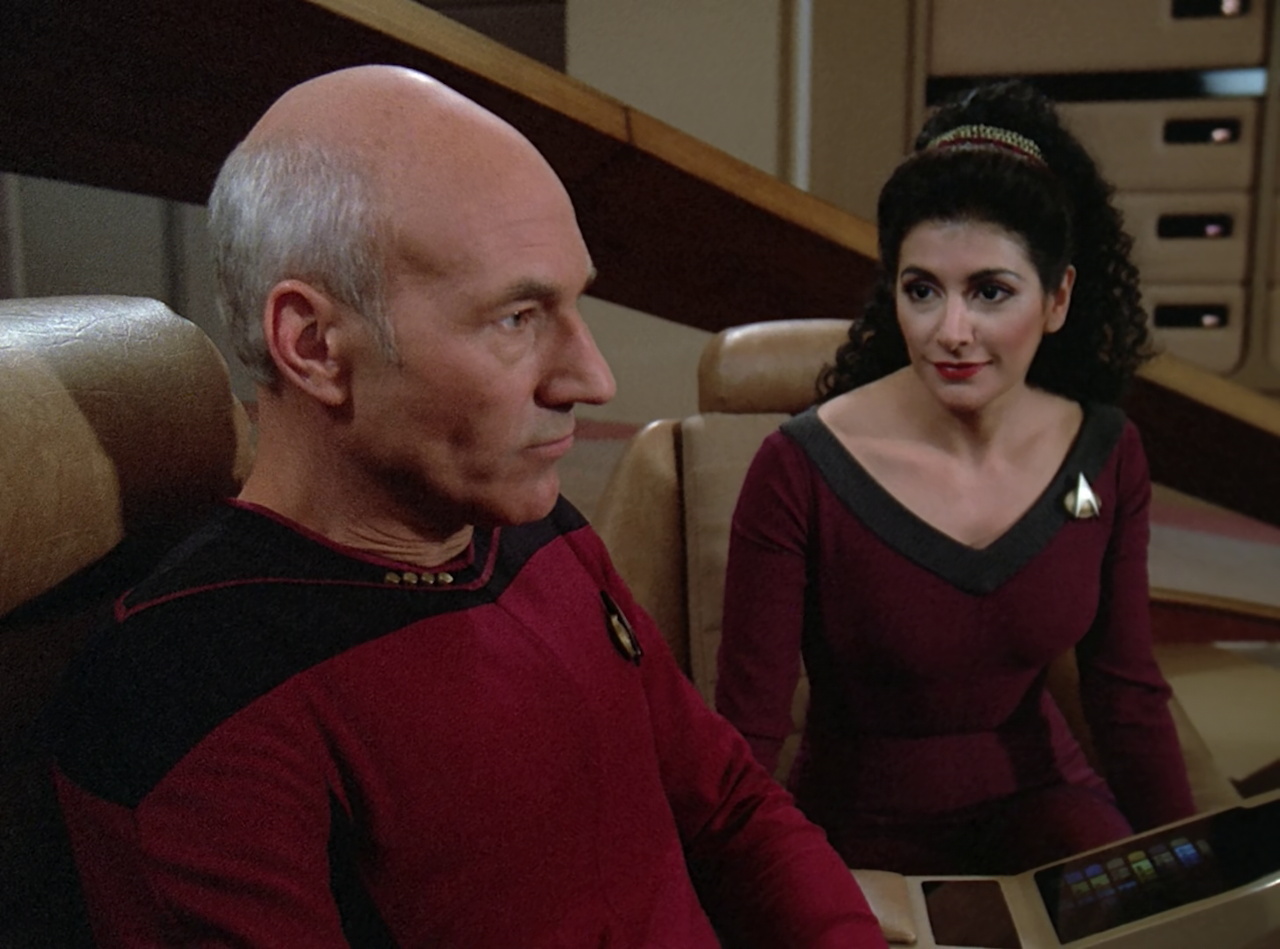 Still frame from Star Trek TNG The Royale showing Picard and Troi