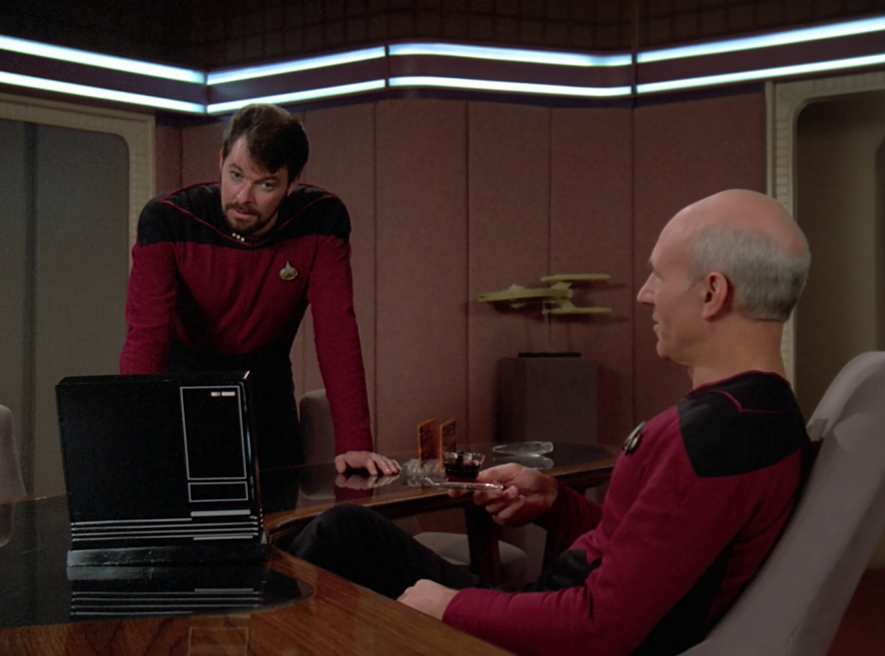 Still frame from Star Trek TNG The Royale showing Riker and Picard