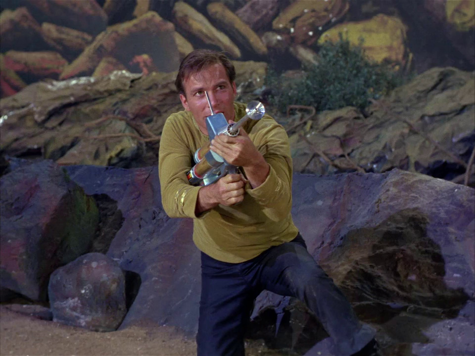 Still frame from Star Trek TOS showing Kirk and his phaser rifle