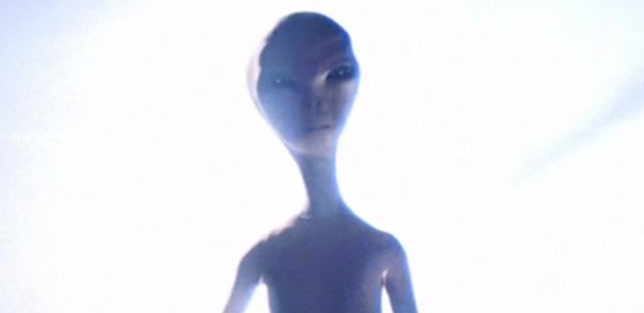 Still frame from Close Encounters of the Third Kind (1977) showing an alien