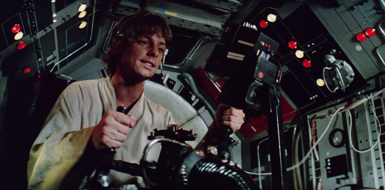 Still frame from Star Wars 1977 showing Luke in the Falcon