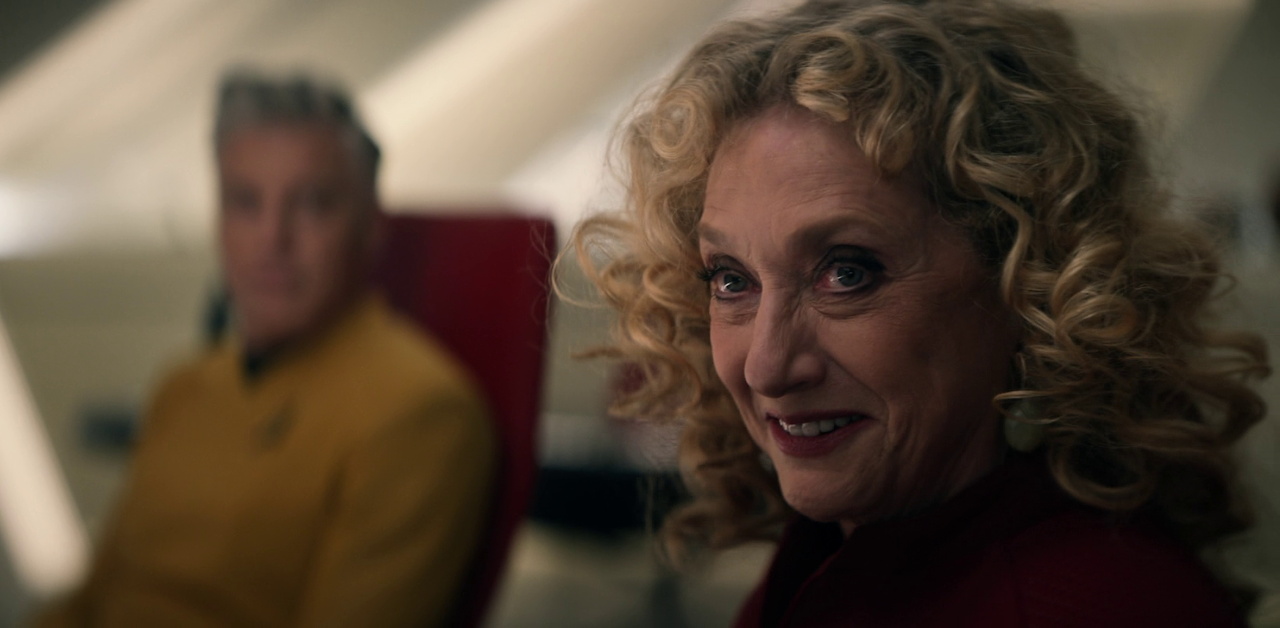 Still frame from Strange New Worlds 4x01 showing Pelia with Pike behind her