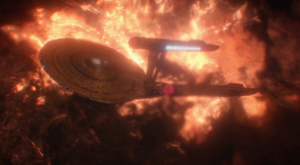 Still frame from Strange New Worlds 4x01 showing the USS Enterprise caught in a solar storm