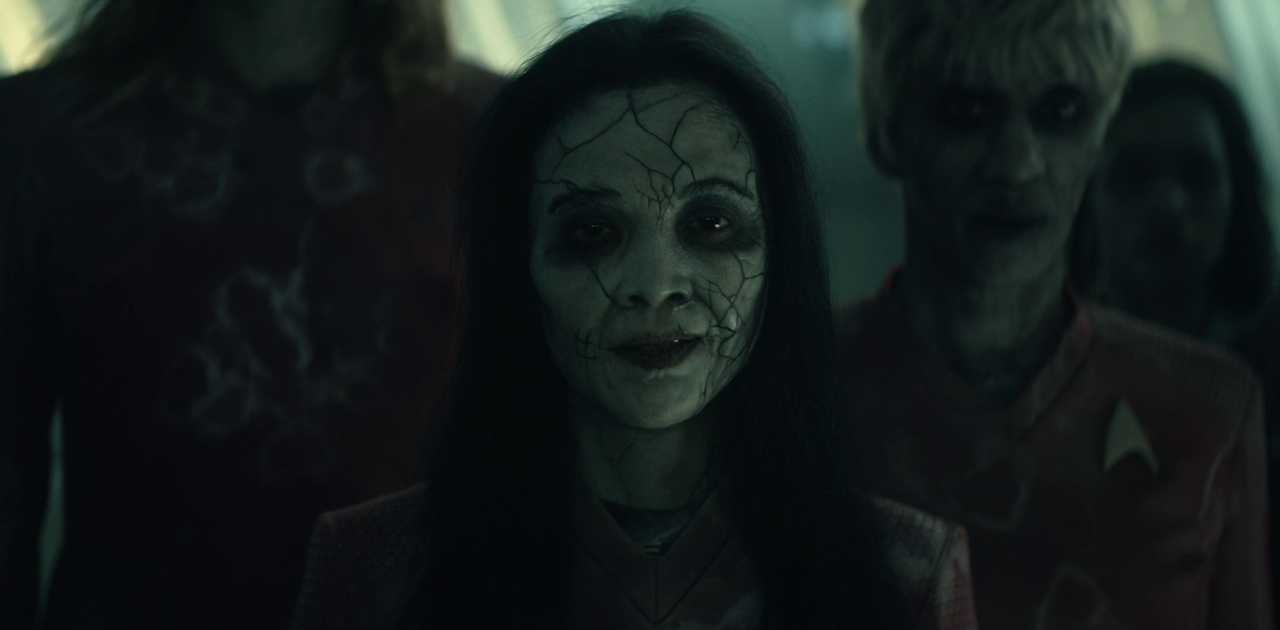 Still frame from Star Trek SNW 4x02 showing Harper with other "ghosts"
