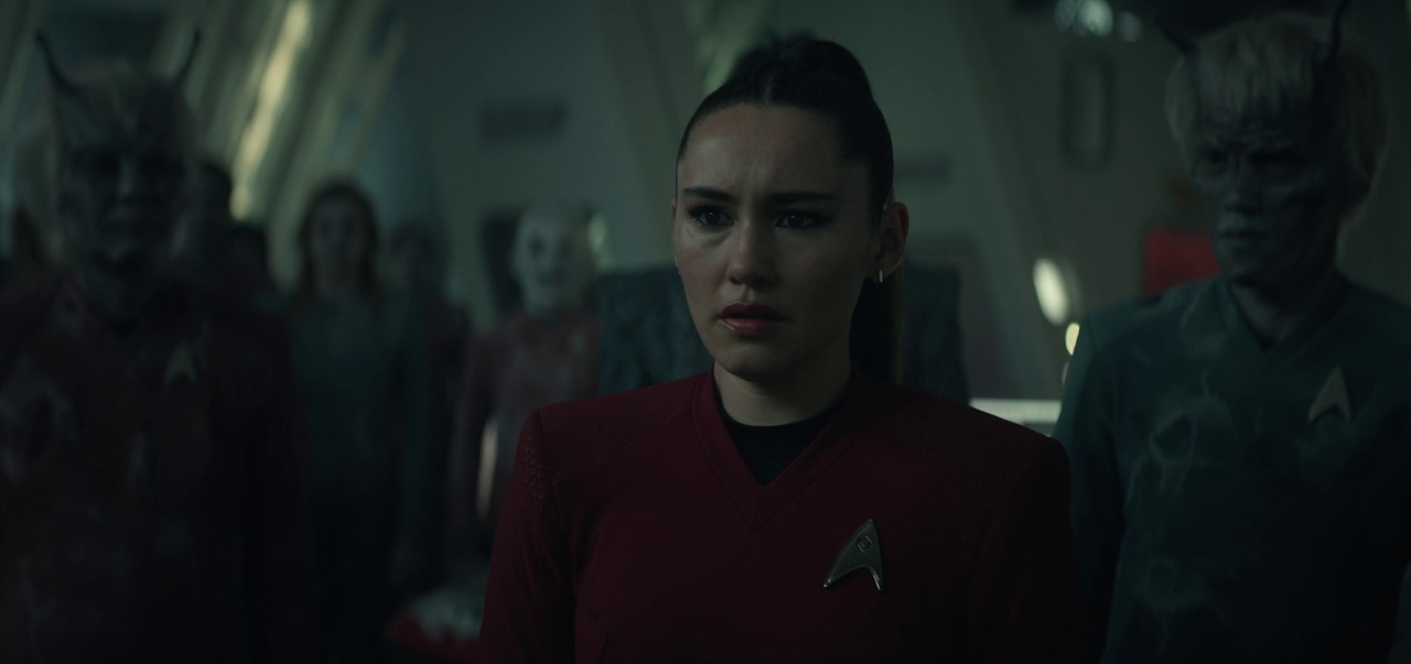 Still frame from Star Trek SNW 4x02 showing La'an with "ghosts"