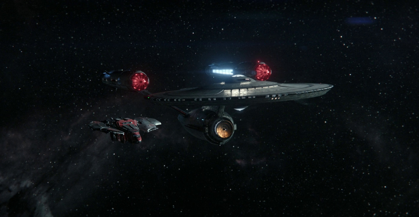 Still frame from Star Trek SNW 4x03 showing the USS Enterprise and an alien ship
