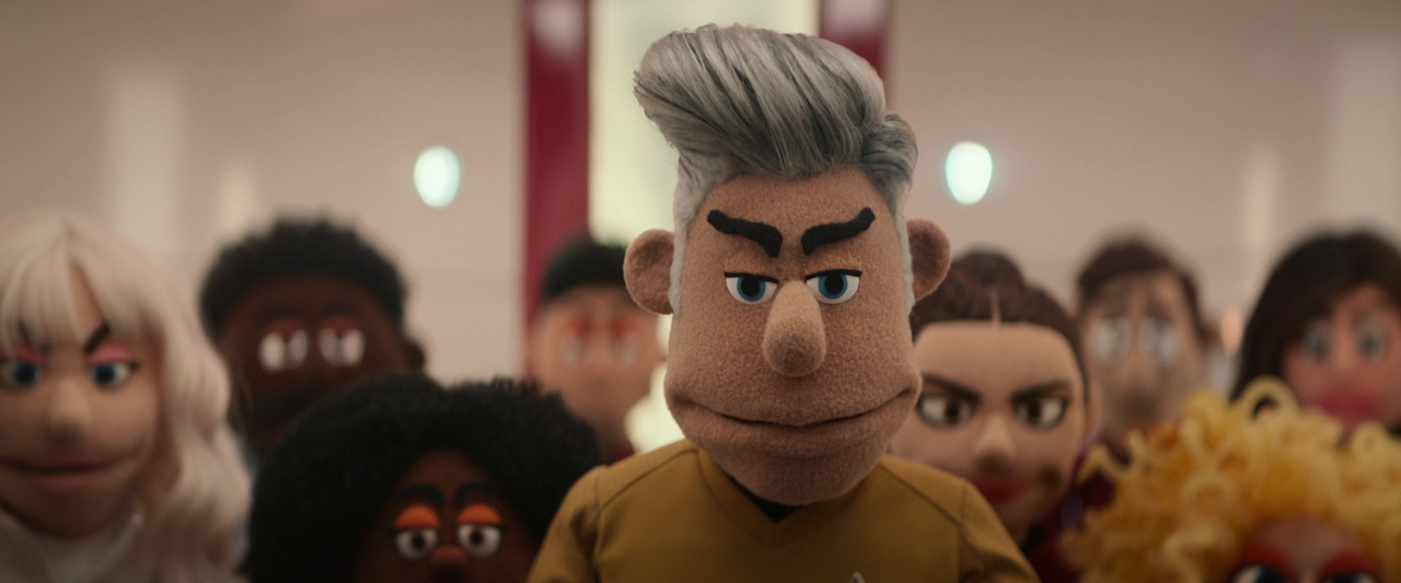 Still frame from Star Trek SNW 4x05 showing puppet Pike and the puppet crew