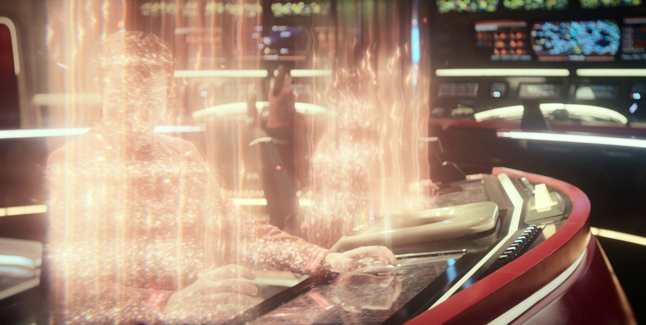 Still frame from Star Trek SNW 4x05 showing Ortegas, the helm console, and transporter beams