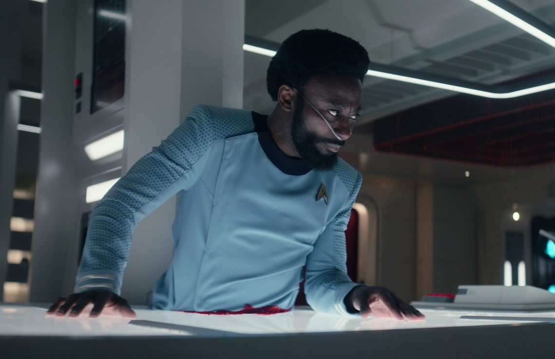 Still frame from Star Trek SNW 4x06 showing Dr M'Benga bisected