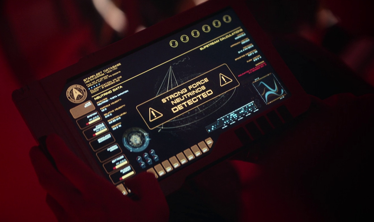 Still frame from Star Trek SNW 4x06 showing a padd with neutrinos