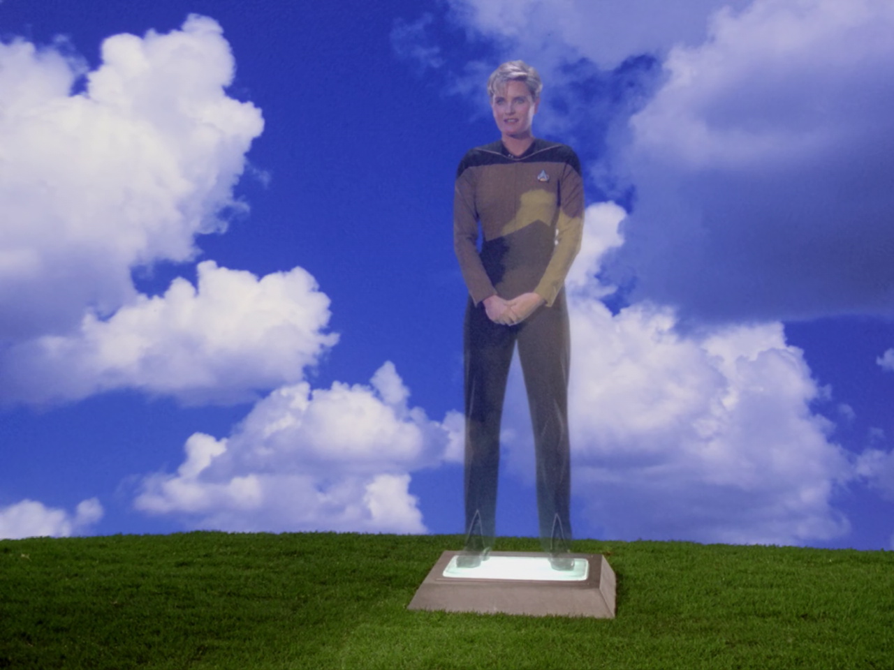 Still frame from Star Trek TNG 1x22 showing Tasha's hologram at her funeral