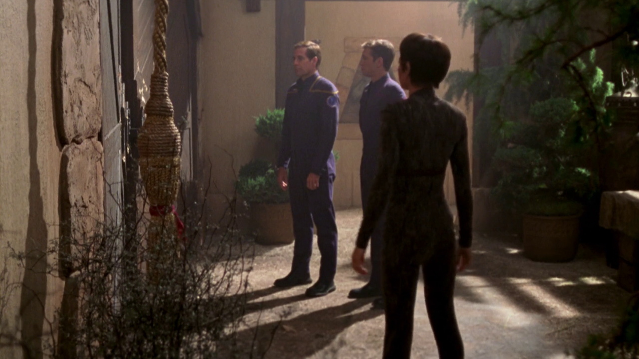 Still frame from Star Trek ENT 1x07 showing Archer, T'Pol, and Tucker at the monastery door