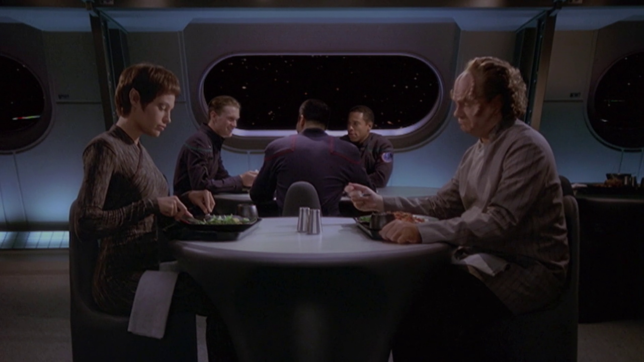 Still frame from Star Trek ENT 1x07 showing T'Pol dining with 
Dr Phlox