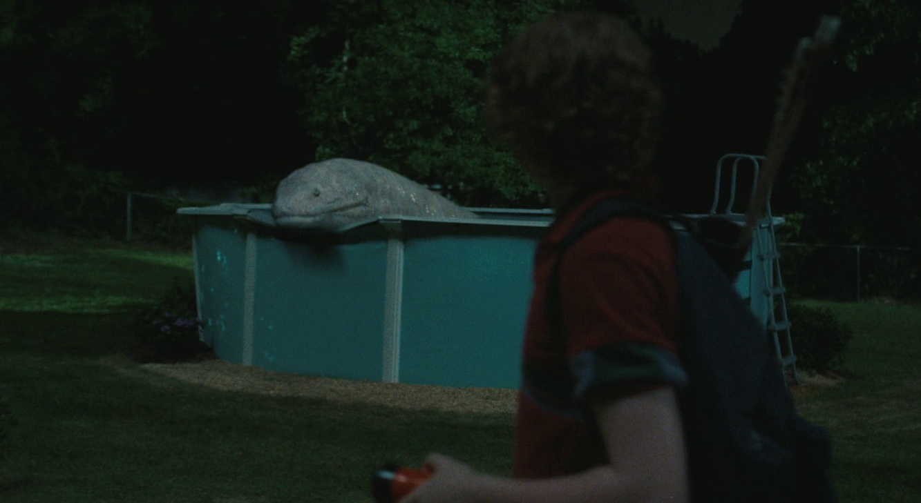 Still frame from The End of Oak Street (2026) showing Brian encountering the snake dino