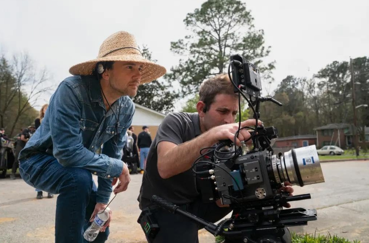Behind-the-scenes photo from The End of Oak Street (2026) showing the director and camera operator
