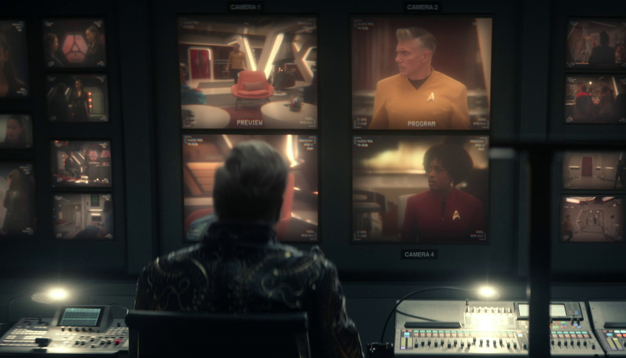 Still frame from Star Trek SNW 4x07 showing Trelane in the booth