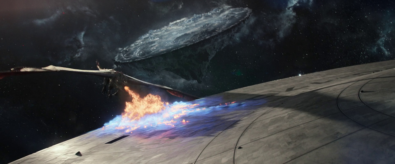 Still frame from Star Trek SNW 4x09 showing the dragon setting fire to the saucer section of the Enterprise