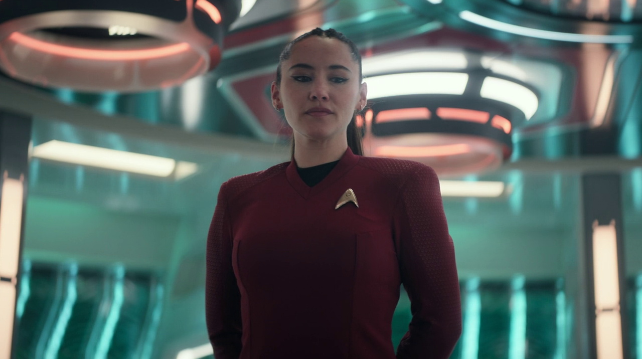 Still frame from Star Trek SNW 4x09 showing La'an on the transporter pad