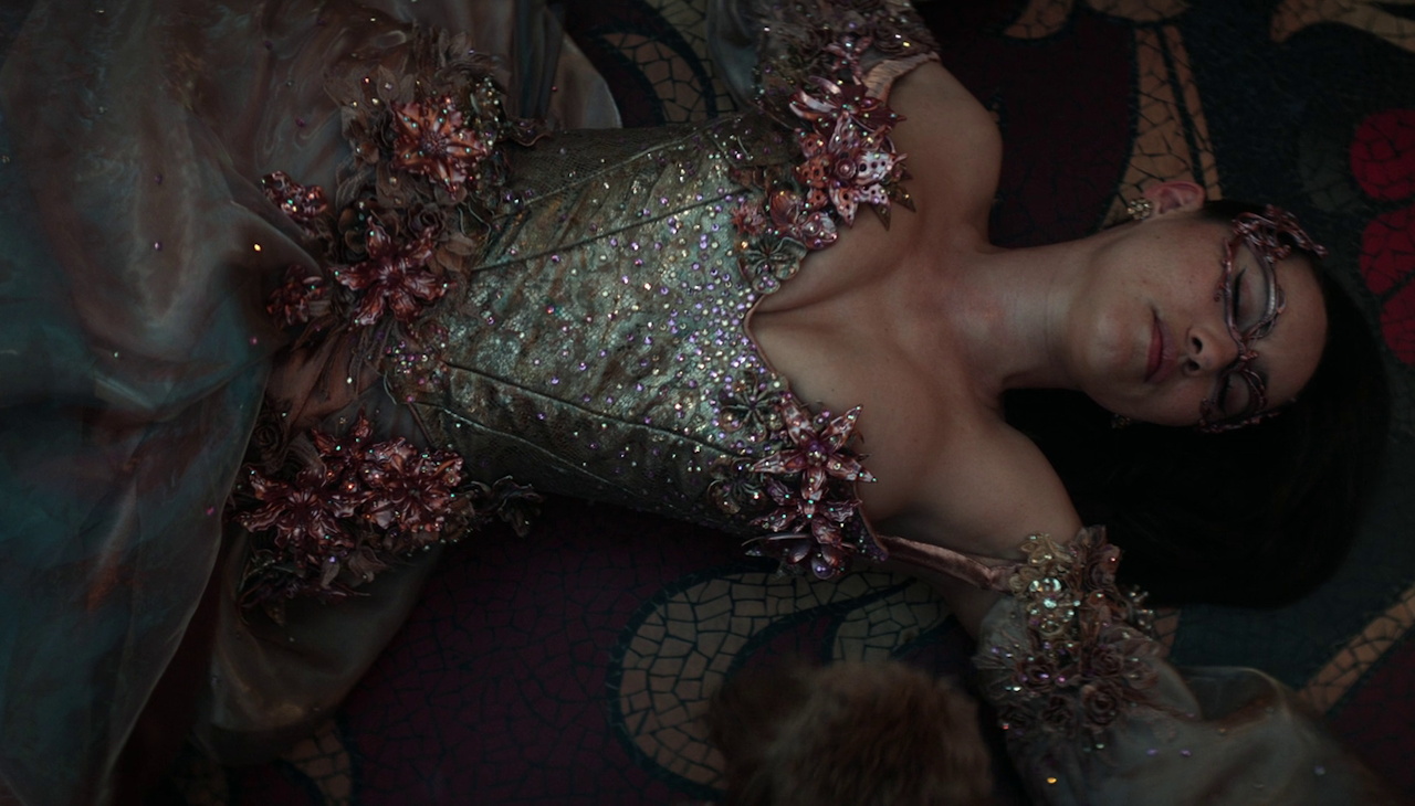 Still frame from Star Trek SNW 4x09 showing La'an unconscious