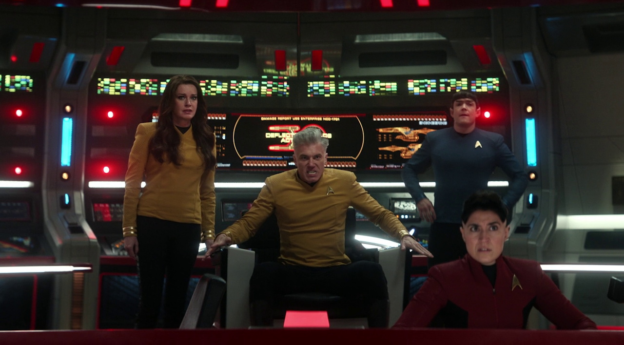 Still frame from Star Trek SNW 4x09 showing Una and Ortegas on the bridge with two doppelgangers