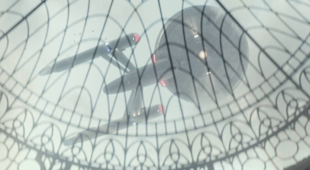 Still frame from Star Trek SNW 4x09 showing the USS Enterprise/iron dragon