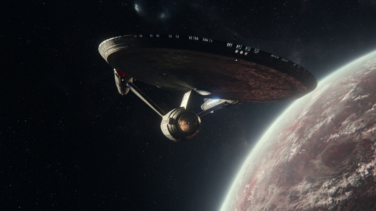 Still frame from Star Trek SNW 4x08 showing the USS Enterprise in orbit