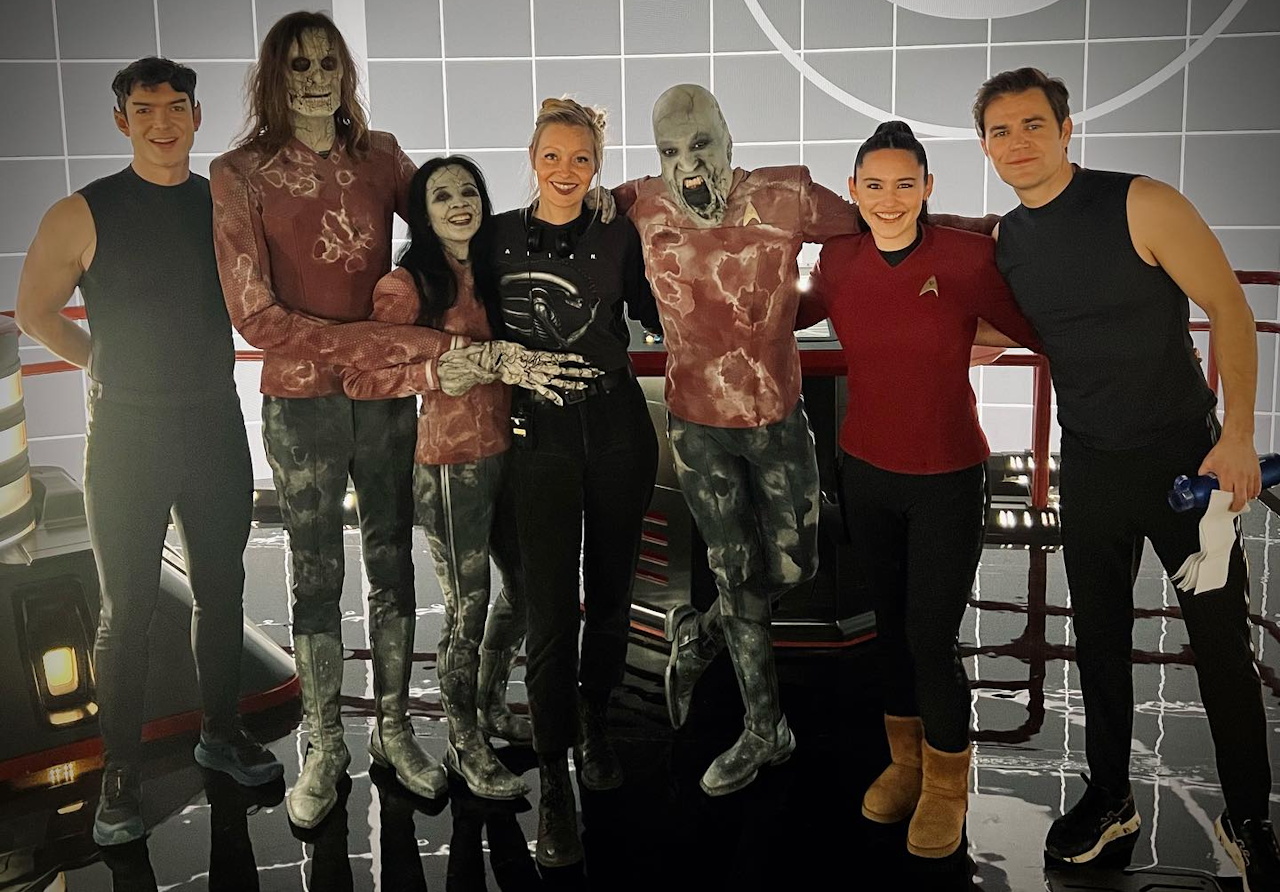 Behind-the-scenes photo from the set of Star Trek SNW S4 showing Peck, Chong, and Wesley with co-stars