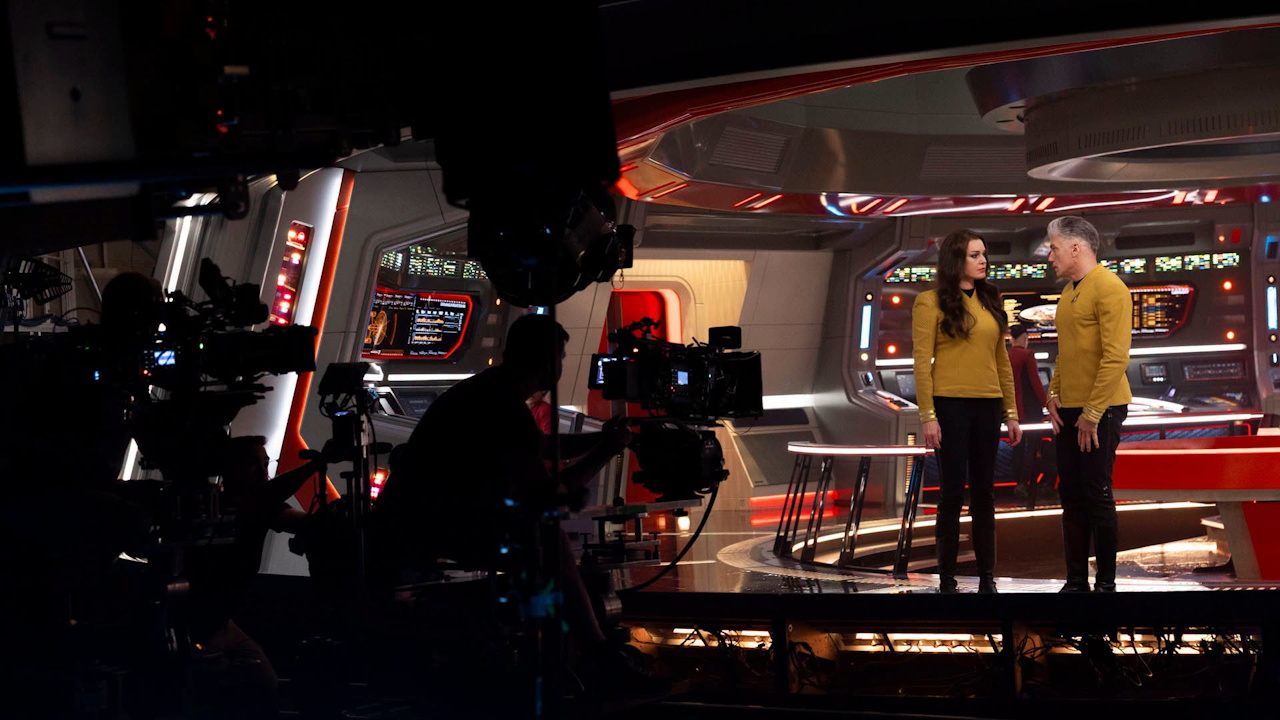 Behind-the-scenes photo from the set of Star Trek SNW S4 showing Mount and Romijn being filmed