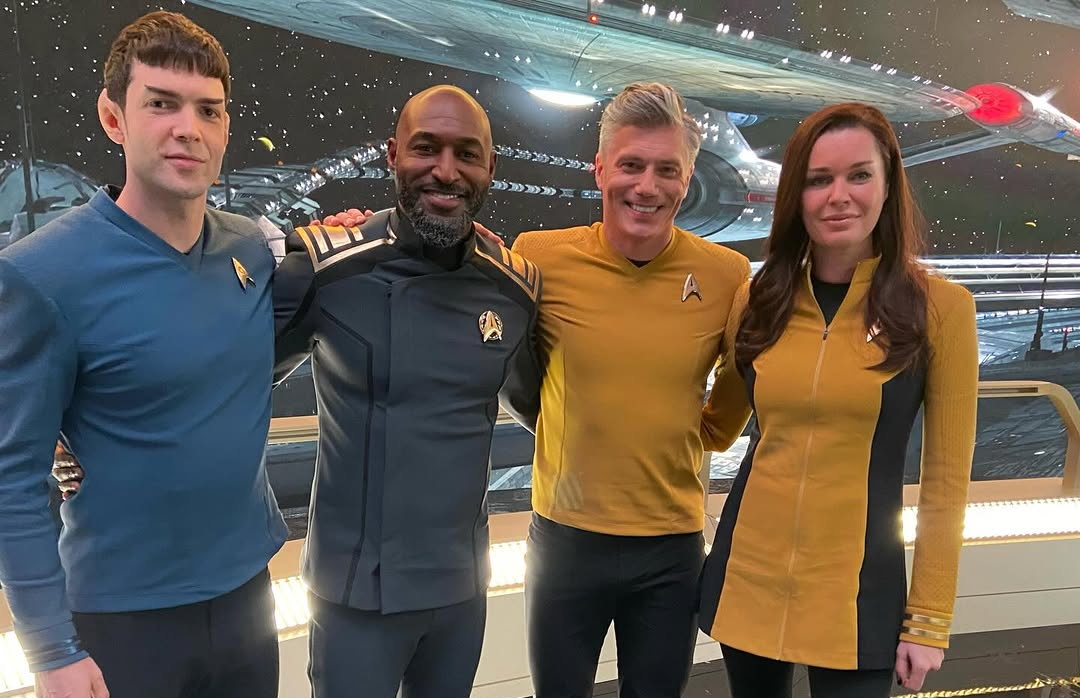 Behind-the-scenes photo from the set of Star Trek SNW S5 showing Peck, Holmes, Mount, and Romijn posing for a photo