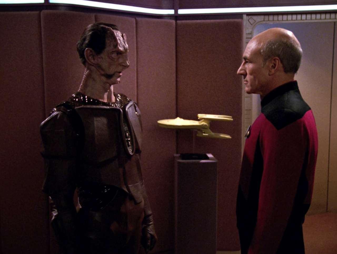 Still frame from Star Trek TNG 4x12 showing Macet and Picard in the ready-room