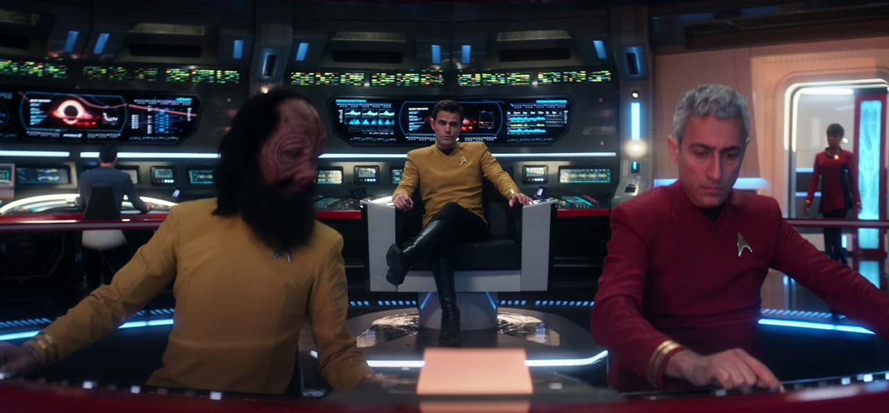 Still frame from Star Trek SNW 4x10 showing Kirk in command on the bridge