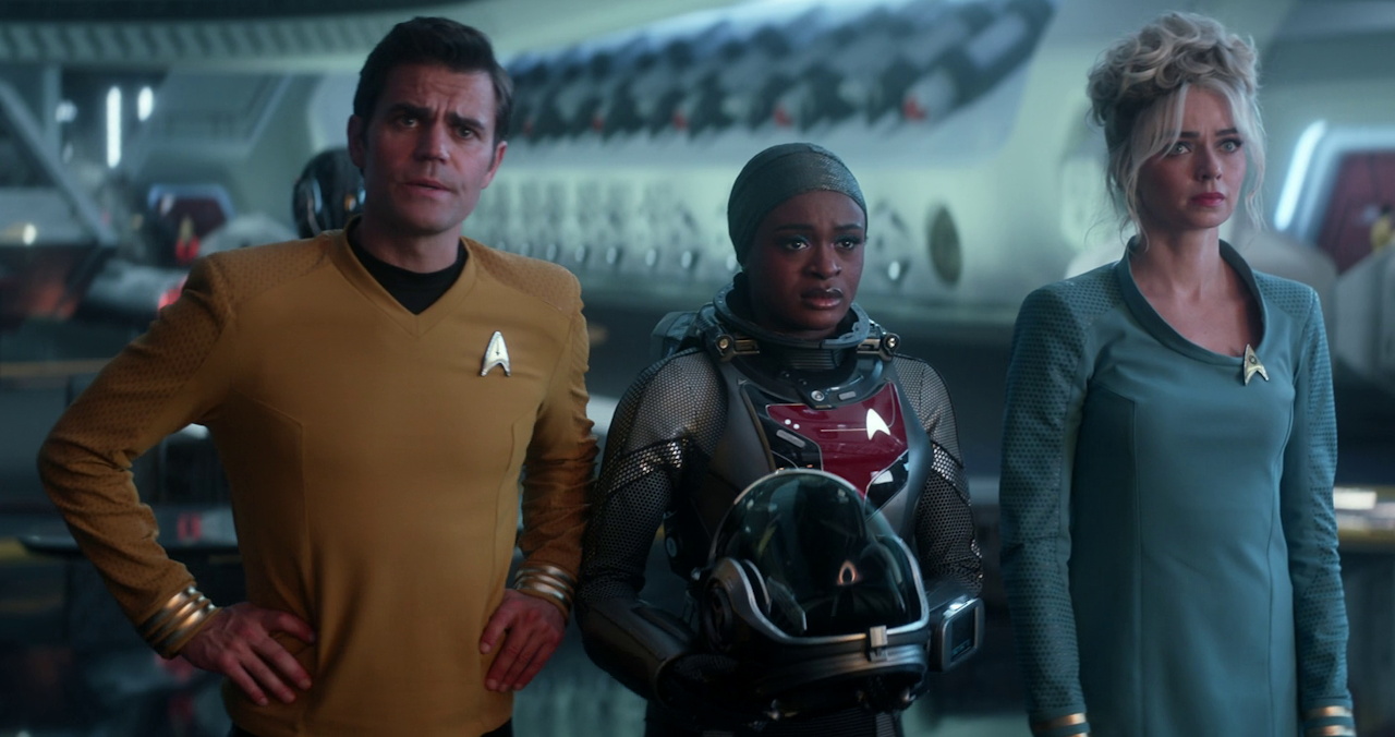 Still frame from Star Trek SNW 4x10 showing Kirk, Uhura, and Chapel in the shuttlebay