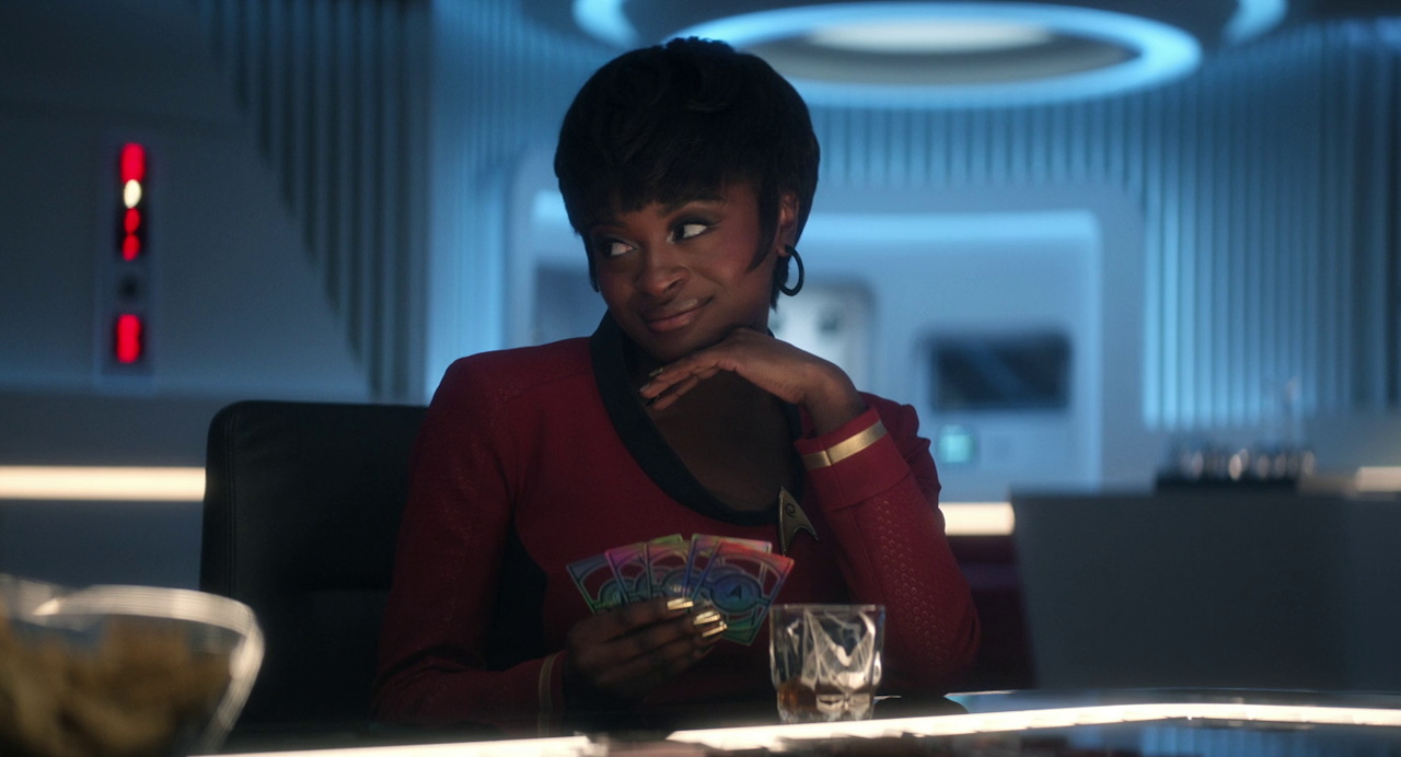 Still frame from Star Trek SNW 4x10 showing Uhura playing poker
