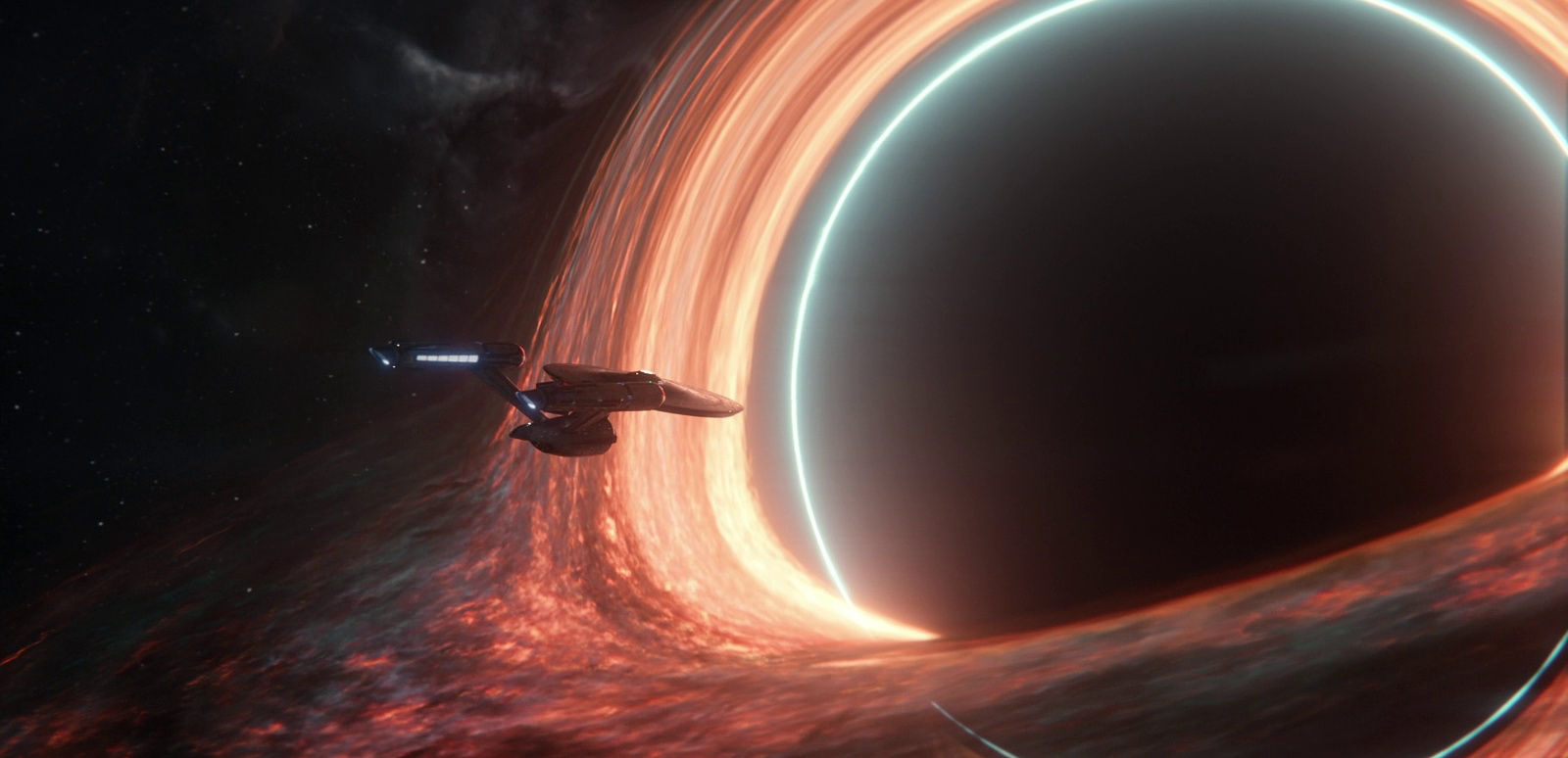 Still frame from Star Trek SNW 4x10 showing the USS Enterprise and a black hole