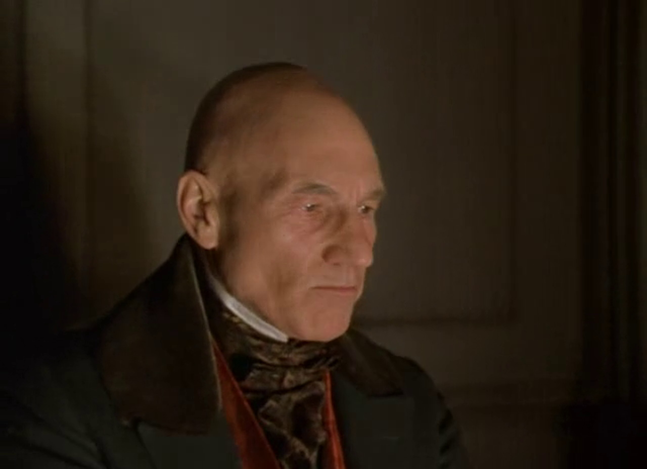Still frame from the 1999 adaptation of A Christmas Carol showing Patrick Stewart as Scrooge