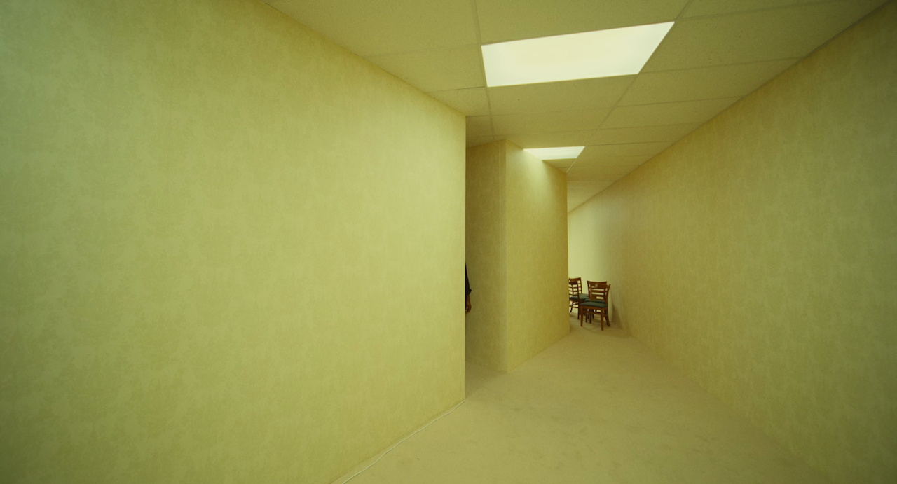 Still frame from Backrooms (2026) showing Clark's arm