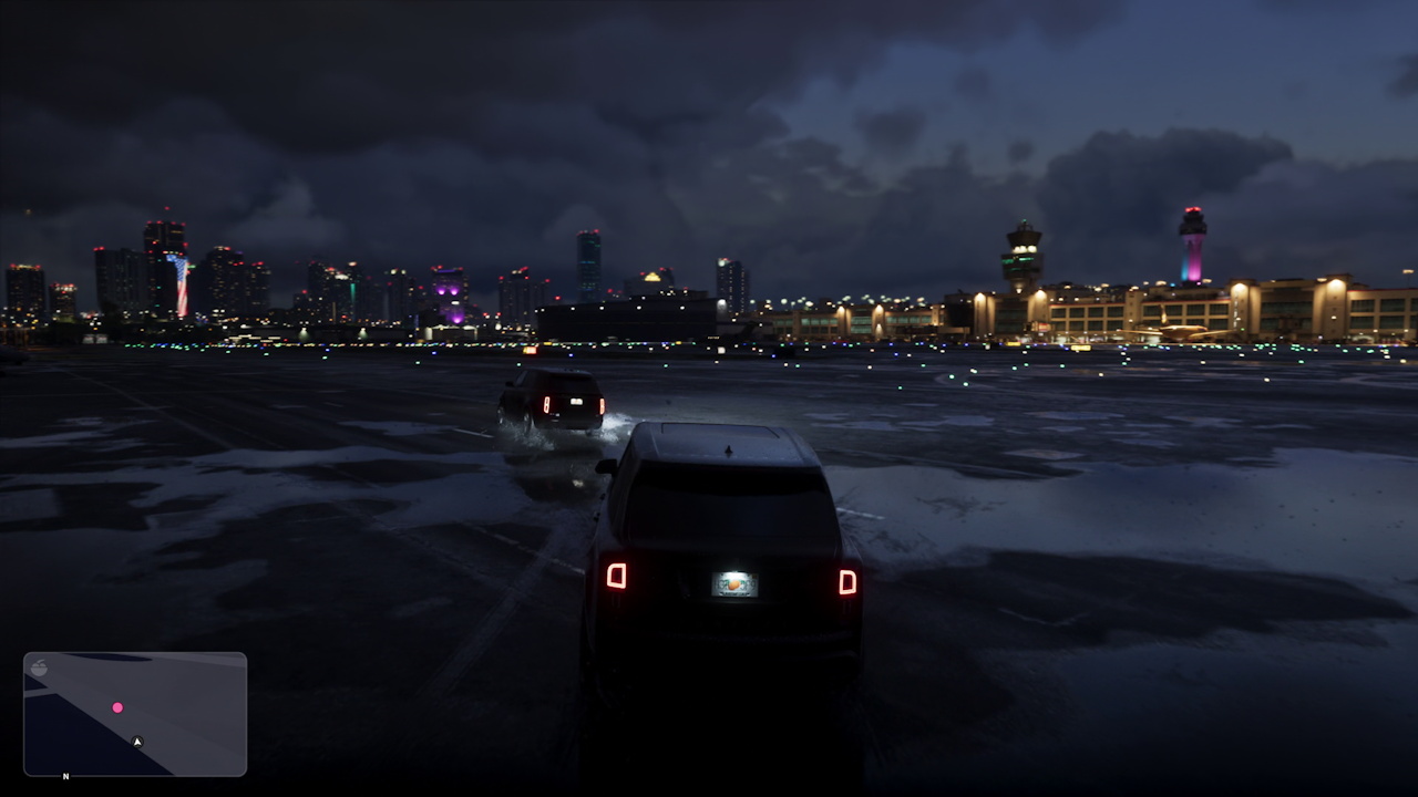 Still frame from the GTA VI Extended Look showing cars at the airport at night