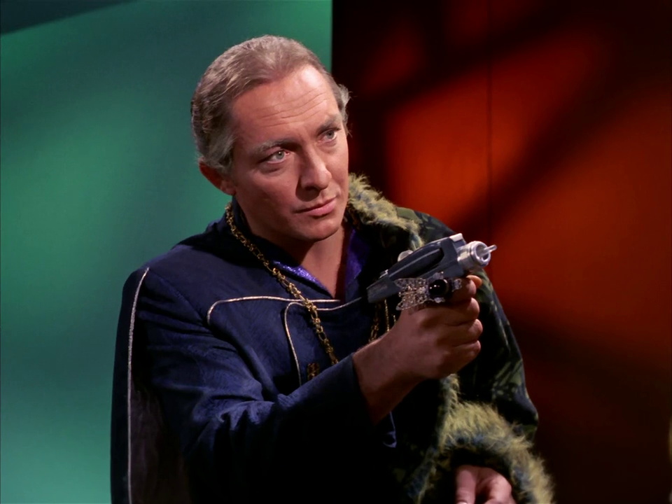 Still frame from Star Trek TOS Whom Gods Destroy showing Garth with a phaser